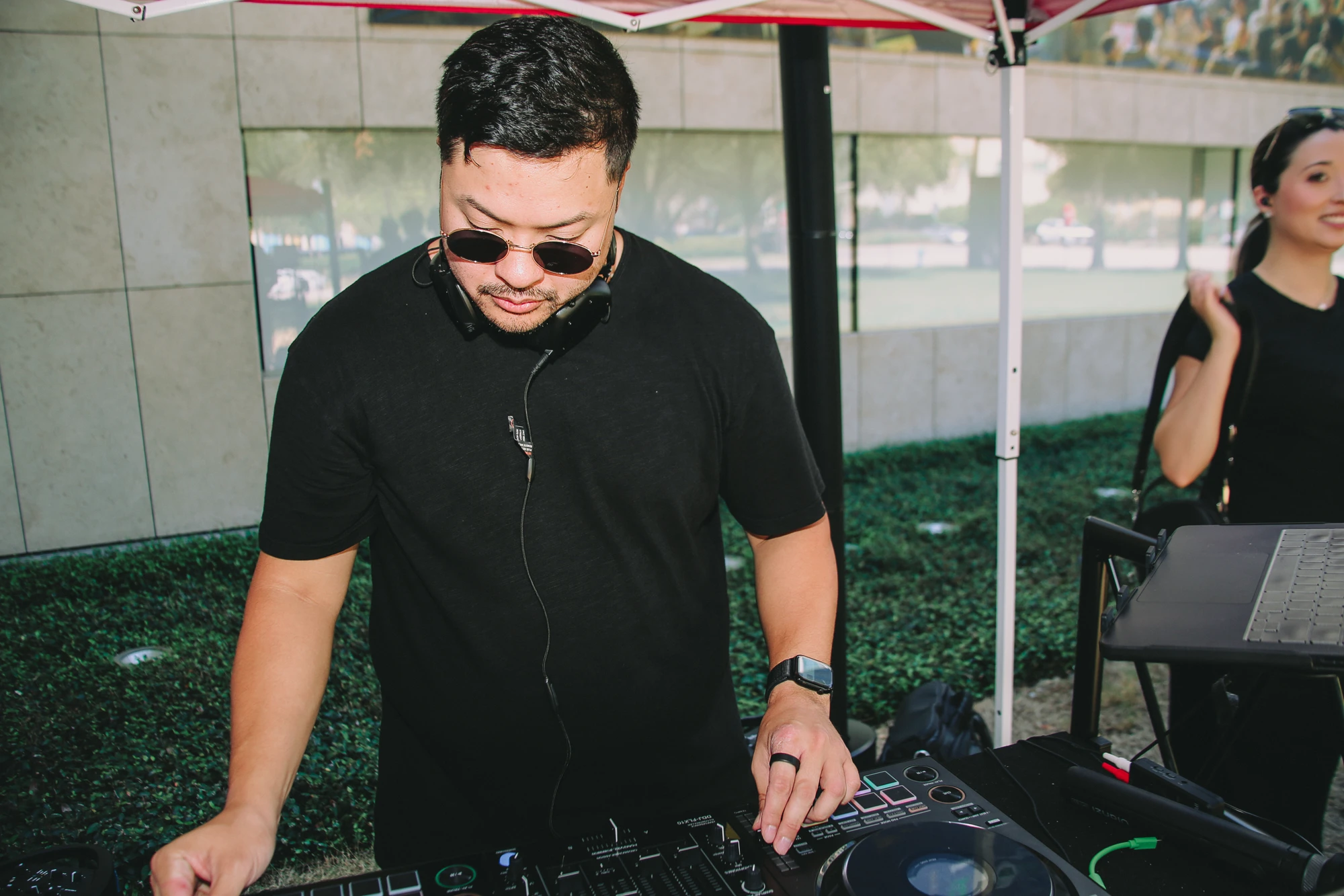 Ninja Noize working the decks in sunglasses and headphones